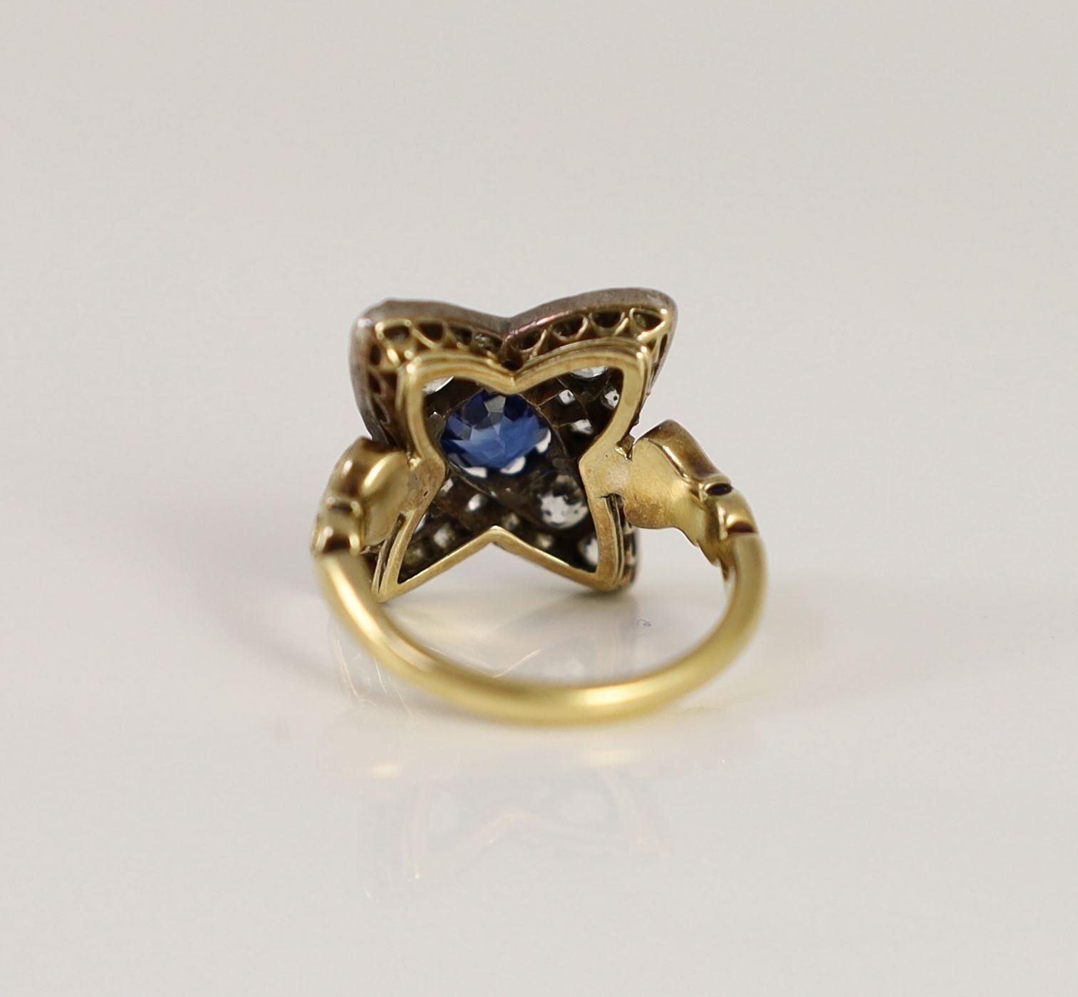 A mid 20th century 18ct gold, sapphire and diamond star shaped cluster dress ring